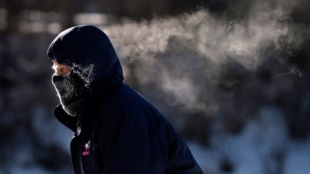 A skater's breath trails behind him as he skates on the Rideau Canal Skateway in Ottawa on Sunday, Feb. 14, 2016 as an extreme cold warning is in affect, with morning temperatures at -28C, feeling like -38C with the wind chill. (THE CANADIAN PRESS / Justin Tang)