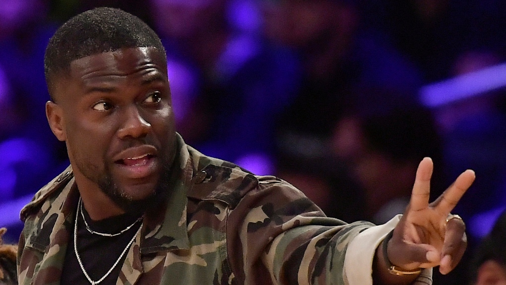 In this Jan. 29, 2019, file photo, actor Kevin Hart gestures during the second half of an NBA basketball game between the Los Angeles Lakers and the Philadelphia 76ers in Los Angeles. (AP Photo/Mark J. Terrill, File)