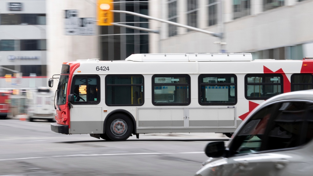 An OC Transpo bus rolls through downtown Ottawa, Thursday April 16, 2020. (Adrian Wyld/THE CANADIAN PRESS)