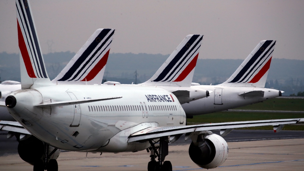 In this file photo dated Friday, May 17, 2019, Air France planes are parked on the tarmac at Paris Charles de Gaulle airport, in Roissy, near Paris. (AP Photo/Christophe Ena, FILE)