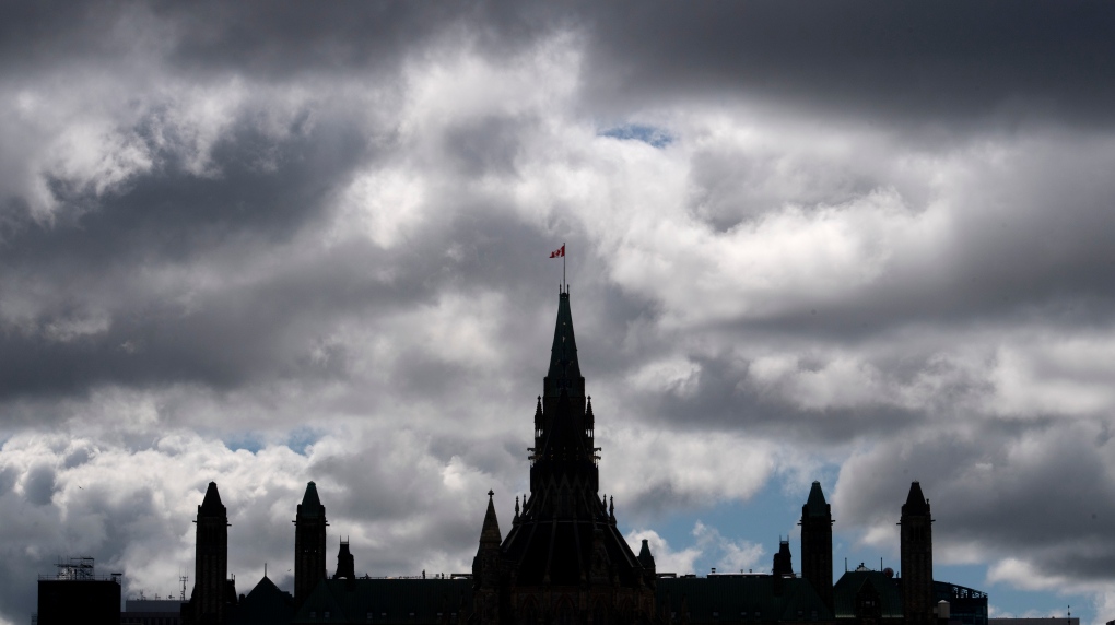 Clouds pass by the parliament buildings Wednesday August 19, 2020 in Ottawa. (Adrian Wyld/THE CANADIAN PRESS)