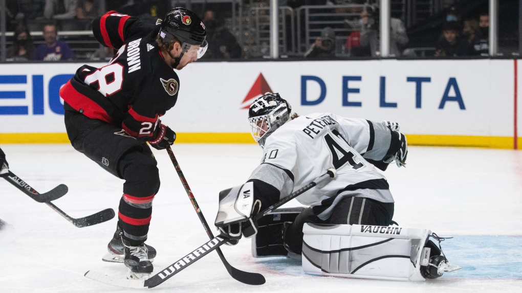 Los Angeles Kings goaltender Cal Petersen (40) blocks a shot by Ottawa Senators right wing Connor Brown (28) in the first period of an NHL hockey game Saturday, Nov. 27, 2021, in Los Angeles. (AP Photo/Kyusung Gong) 