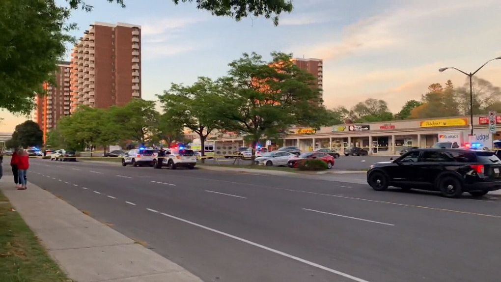 Yellow police tape surrounds the parking lot of the Alta Vista Shopping Centre after a shooting on Friday, May 28. (Jackie Perez/CTV News Ottawa)