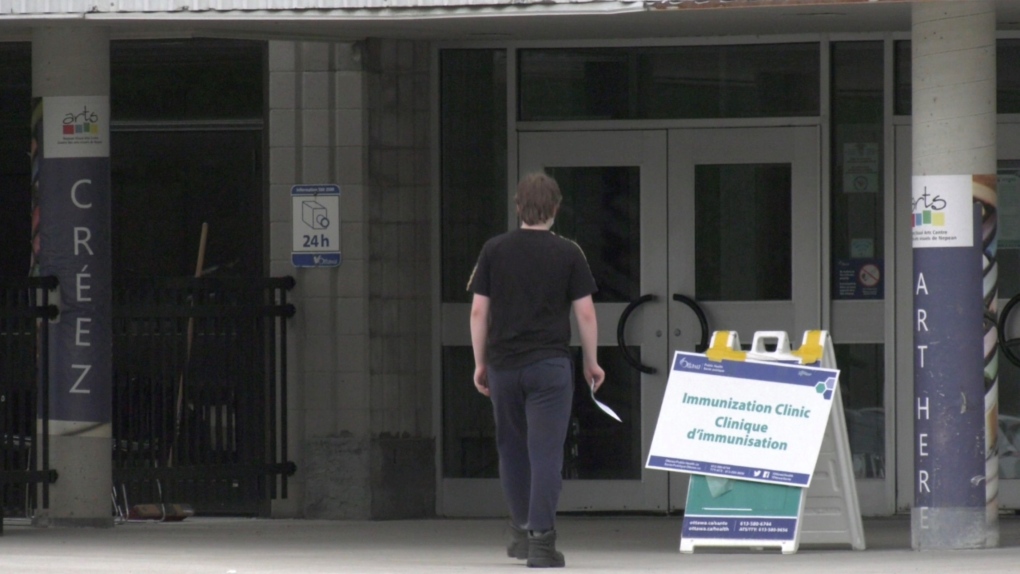 An Ottawa resident walks into a city community vaccination clinic on Sunday. (Colton Praill/CTV News Ottawa)