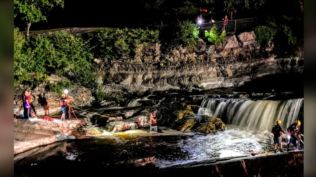Fire crews rescued a man found clinging to a ledge in the middle of the Rideau River at Hog's Back Falls on Sunday night. (Ottawa Fire Services)