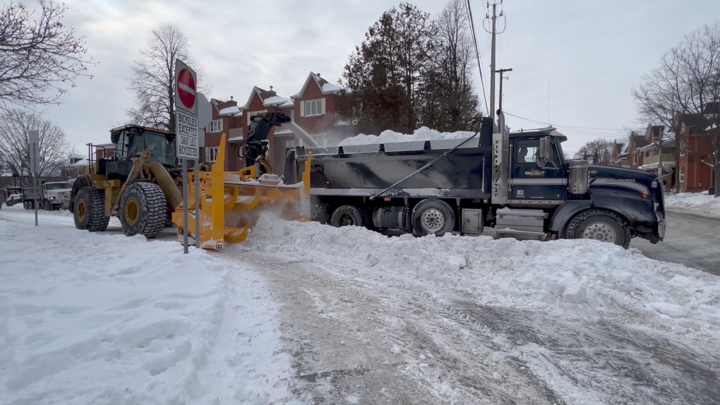 Crews remove snow in The Glebe on Monday, Jan. 24, 2022. (Dave Charbonneau/CTV News Ottawa)
