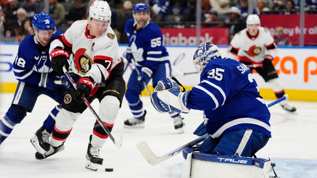 Ottawa Senators' Brady Tkachuk (7) battles for the puck with Toronto Maple Leafs' Rasmus Sandin (38) as Maple Leafs goaltender Ilya Samsonov (35) looks for the puck during third period NHL hockey action in Toronto on Saturday, October 15, 2022. (Frank Gunn/THE CANADIAN PRESS)