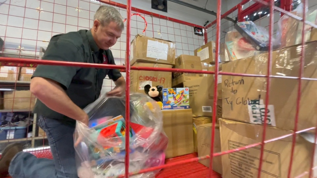 Bob Rainboth helps pack up donated toys ahead of the Help Santa Toy Parade on Saturday. (Dave Charbonneau/CTV News Ottawa) 