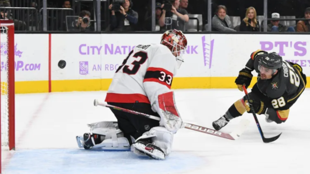 Golden Knights' William Carrier puts the puck past Senators goalie Cam Talbot during the second period of a 4-1 win on Wednesday night in Las Vegas. (Candice Ward/Getty Images)