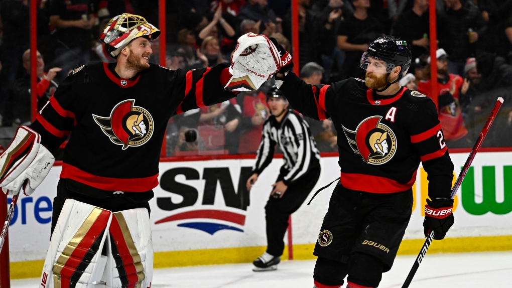Ottawa Senators right wing Claude Giroux (28) celebrates his goal against the San Jose Sharks with goaltender Anton Forsberg (31) during third period NHL hockey action in Ottawa, on Saturday, Dec. 3, 2022. (Justin Tang/THE CANADIAN PRESS)
