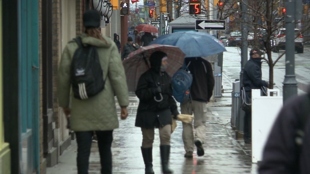 People with umbrellas walk down an Ottawa street in this undated photograph. (CTV News Ottawa)