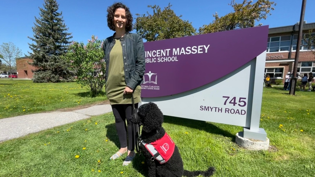 Meaghan Martin is an educational assistant at Vincent Massey Public School. Her hearing dog guide, Olive alerts her to important sounds. (Peter Szperling/CTV News Ottawa) 
