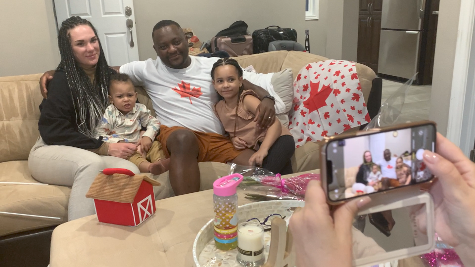 Adrian Hokcha Djiele along with his wife Alina Khoksha Dzhiel, six-year-old daughter Sabrina and one-year-old son Christopher settle in their new Ottawa home with help from members of the Global Black Coalition. (Jackie Perez/CTV News Ottawa) 