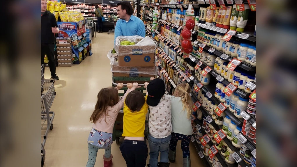 4-year-old Lev Goldfarb (2nd from right, in backwards cap) and his friends celebrate his birthday at the local Metro grocery store. (Hadas Brajtman/supplied)