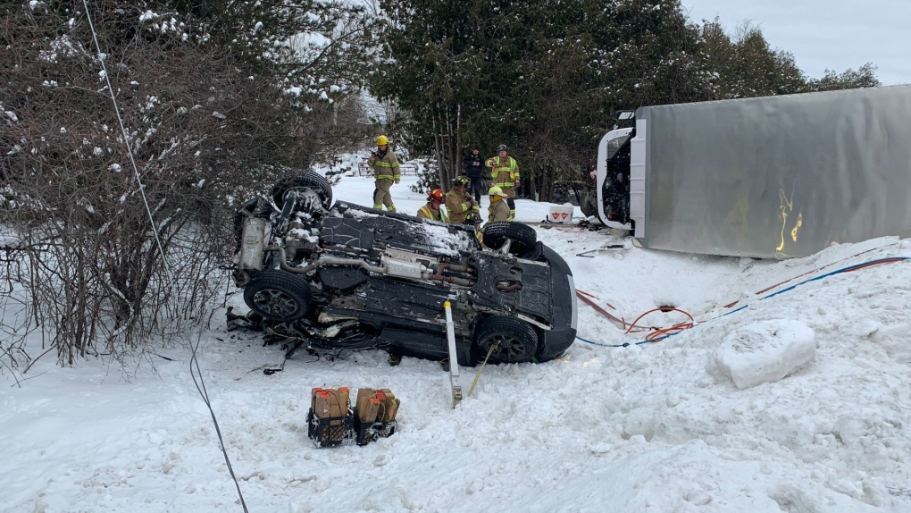A woman was sent to hospital after her car was sandwiched between a truck and a school bus in North Grenville, Ont. on Wednesday. (OPP)