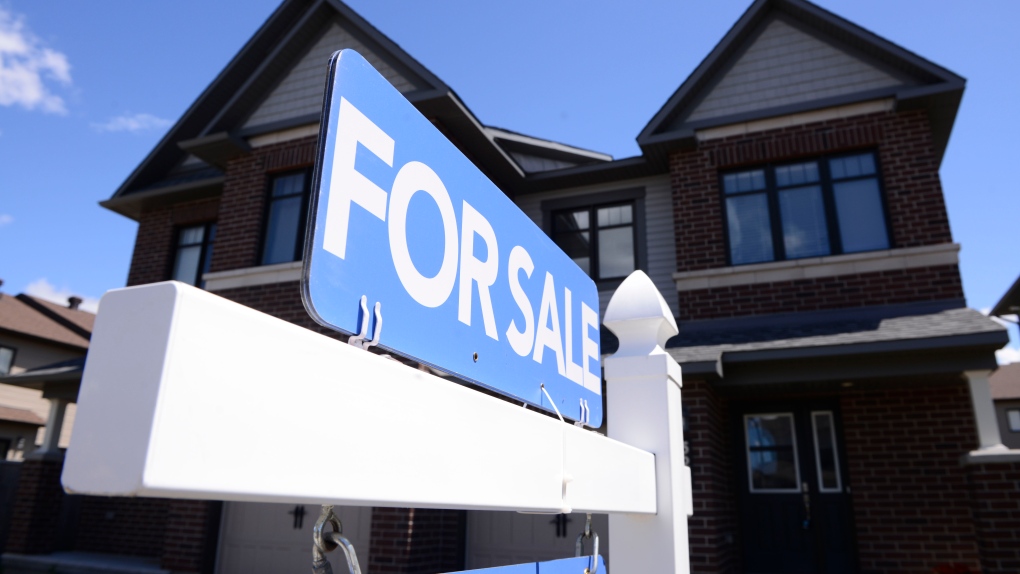 A new home is displayed for sale, in Ottawa on Tuesday, July 14, 2020.  THE CANADIAN PRESS/Sean Kilpatrick