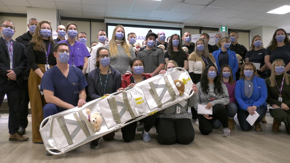 CHEO staff recognized Ottawa firefighters with teddy bears, as firefighters recognized them with challenge coins, after last month's dramatic efforts to move 17 NICU babies during a fire. (Katelyn Wilson/CTV News Ottawa)