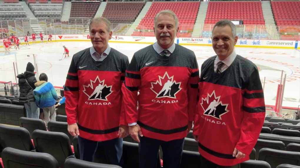 Cyril Leeder, president and chief executive officer of the Ottawa Senators; Neil Lumsden, Ontario Minister of Tourism, Culture and Sport; and Mayor Mark Sutcliffe pose at the Canadian Tire Centre. (Leah Larocque/CTV News Ottawa)