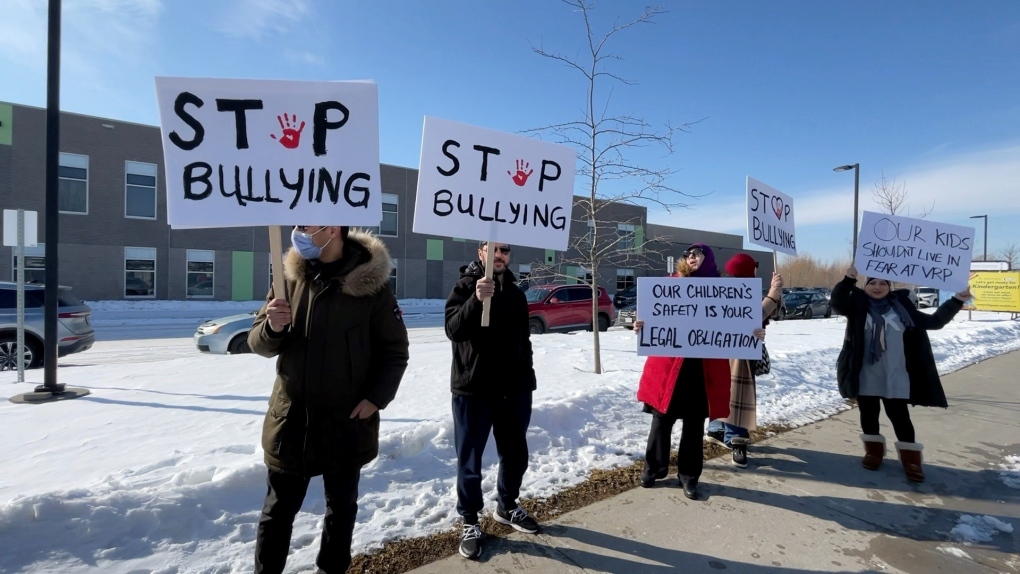 Parents protest outside Vimy Ridge Public School to draw attention to their concerns about bullying, which they say is getting out of control. Feb. 13, 2023. (Peter Szperling/CTV News Ottawa)