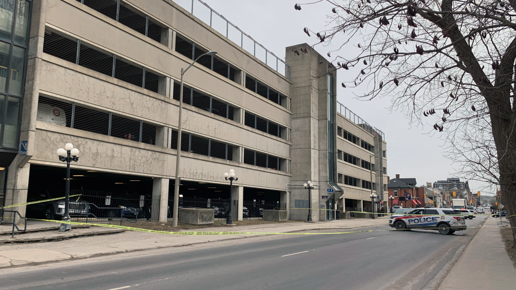 Police tape was put up at the parking garage for the Hotel Dieu Hospital in downtown Kingston, Ont. March 22, 2023. The Special Investigations Unit is investigating the circumstances of a man's death after he fell from the fourth storey of the garage. (Kimberley Johnson/CTV News Ottawa)