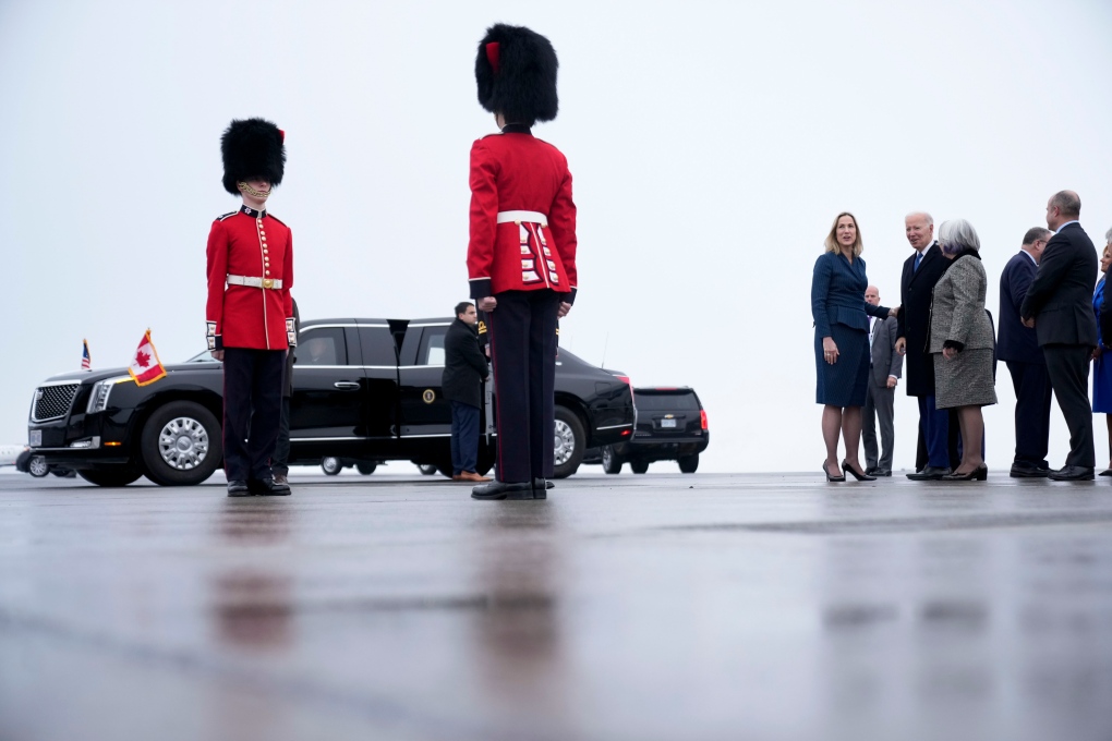 President Joe Biden speaks with Kirsten Hillman, Canada's ambassador to the United States, left in blue, and Canada's Gov. Gen. Mary Simon, second from right, as Biden arrives at Ottawa International Airport, Thursday, March 23, 2023, in Ottawa, Canada. (AP Photo/Andrew Harnik)