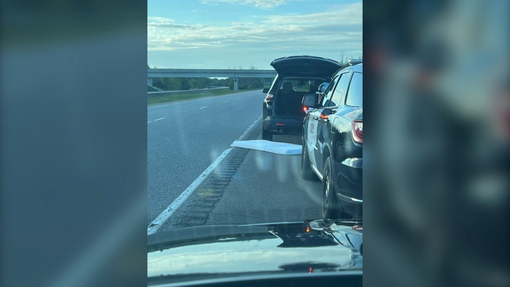 Ontario Provincial Police say a vehicle stopped on Hwy. 416 Friday had two children sleeping in the back on a mattress. (Ontario Provincial Police/Twitter)