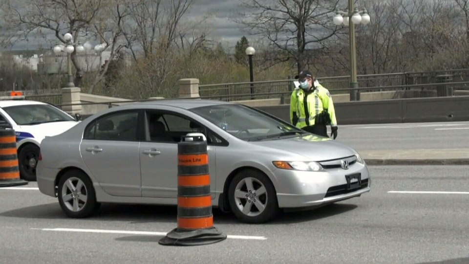 Ottawa police staff checkpoints, wave cars throug